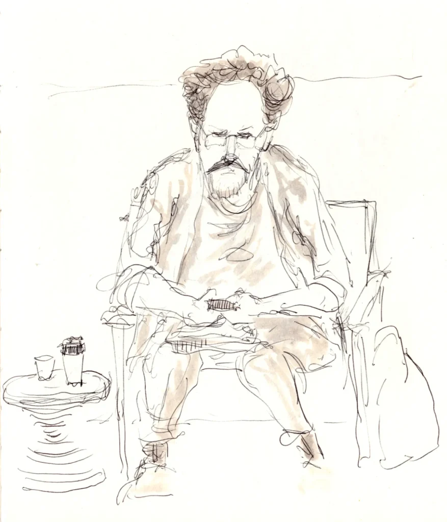 Ballpoint sketch of a man staring at his phone in a coffee shop.
